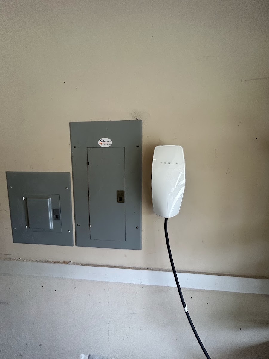 Electrician reviewing a project plan before beginning electrical installation work.